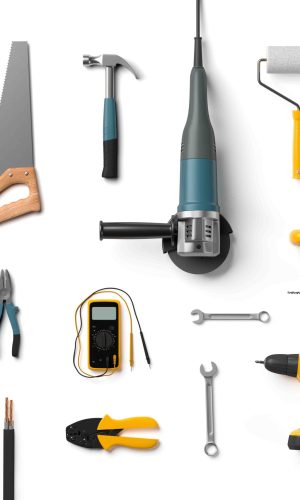 helmet, drill, angle grinder and other construction tools on a white background isolated